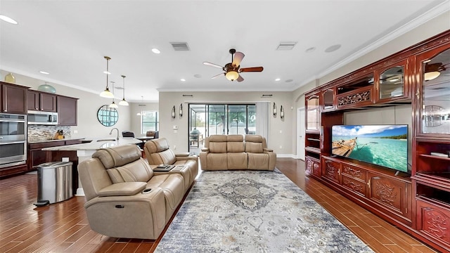5324 Moon Shell Dr, Apollo Beach, FL 33572 - living room with dark wood-style flooring, ceiling fan, crown molding, recessed lighting, and baseboards