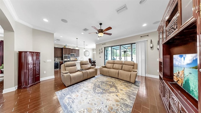 5324 Moon Shell Dr, Apollo Beach, FL 33572 - living area featuring dark wood-style floors, a ceiling fan, crown molding, recessed lighting, and baseboards