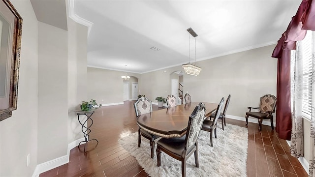 5324 Moon Shell Dr, Apollo Beach, FL 33572 - dining area with arched walkways, wood finished floors, baseboards, and ornamental molding