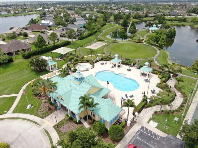 5324 Moon Shell Dr, Apollo Beach, FL 33572 - aerial perspective of suburban area with a nearby body of water and a pool area