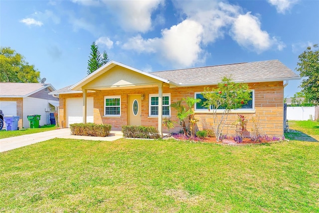 ranch-style home featuring a front yard, an attached garage, fence, and concrete driveway