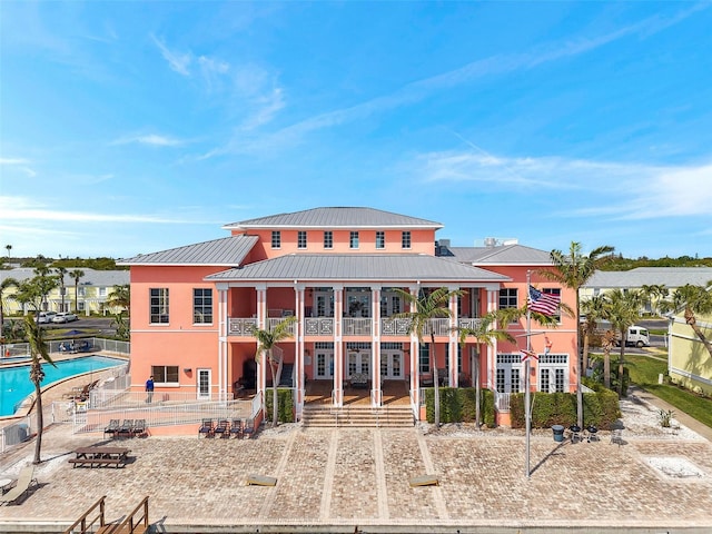 view of building exterior with a community pool