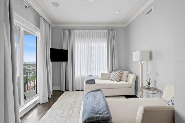 146 4th Ave NE Unit 600, Saint Petersburg, FL 33701 - living room with wood finished floors, ornamental molding, baseboards, and visible vents