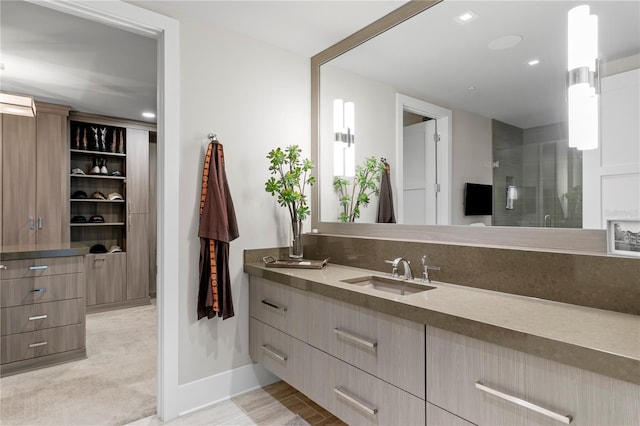 146 4th Ave NE Unit 600, Saint Petersburg, FL 33701 - bathroom with vanity, baseboards, and a shower stall