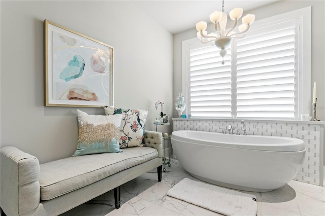 146 4th Ave NE Unit 600, Saint Petersburg, FL 33701 - full bath with marble finish floor, a soaking tub, and a chandelier