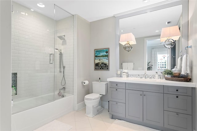 146 4th Ave NE Unit 600, Saint Petersburg, FL 33701 - full bathroom featuring vanity, toilet, tile patterned floors, visible vents, and enclosed tub / shower combo