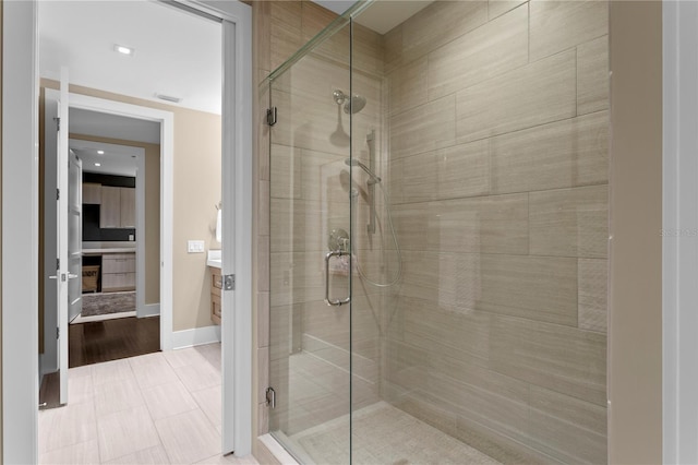 146 4th Ave NE Unit 600, Saint Petersburg, FL 33701 - bathroom with a shower stall and baseboards