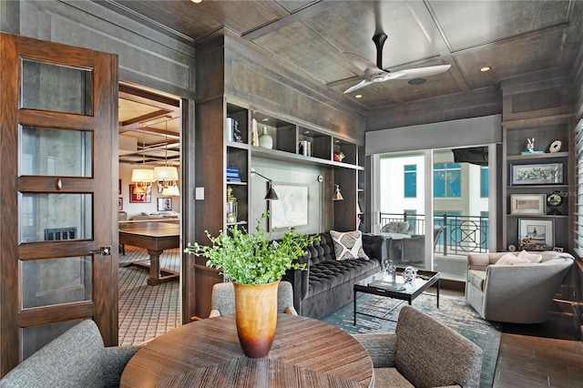 146 4th Ave NE Unit 600, Saint Petersburg, FL 33701 - living area with built in shelves and a ceiling fan