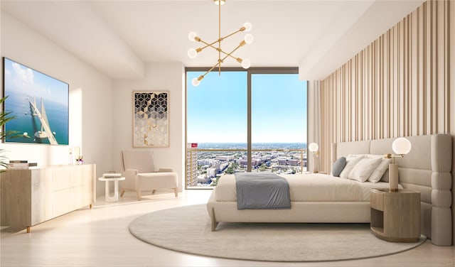 bedroom featuring wood finished floors, a chandelier, and floor to ceiling windows