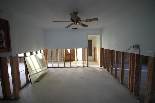 unfurnished room with concrete floors and ceiling fan