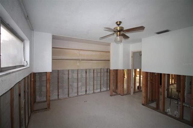 interior space featuring visible vents and ceiling fan