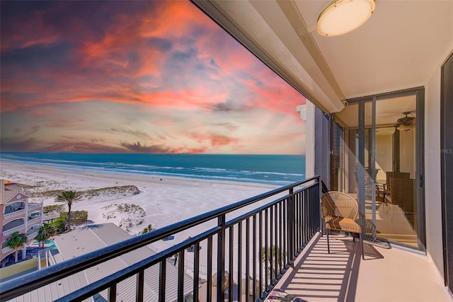 balcony with a view of the beach and a water view