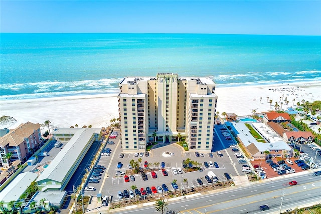 bird's eye view with a view of the beach and a water view