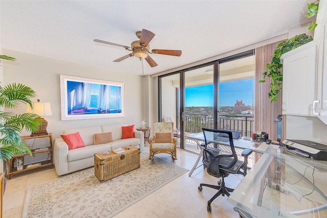 office area with a ceiling fan and expansive windows