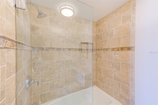 bathroom with bathing tub / shower combination