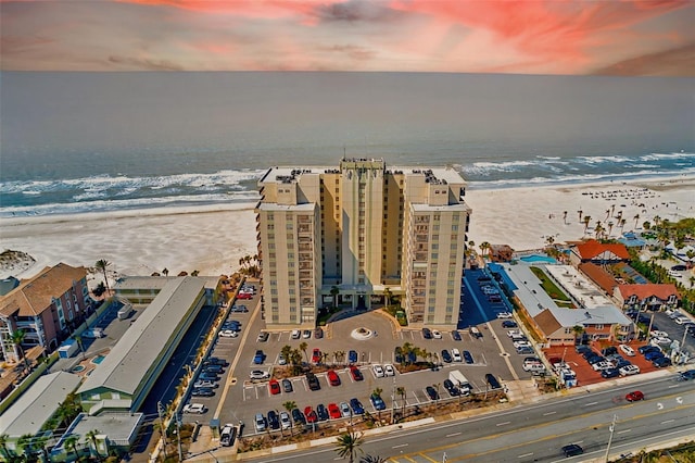 bird's eye view featuring a beach view and a water view