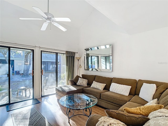 living room featuring high vaulted ceiling, a ceiling fan, and wood finished floors