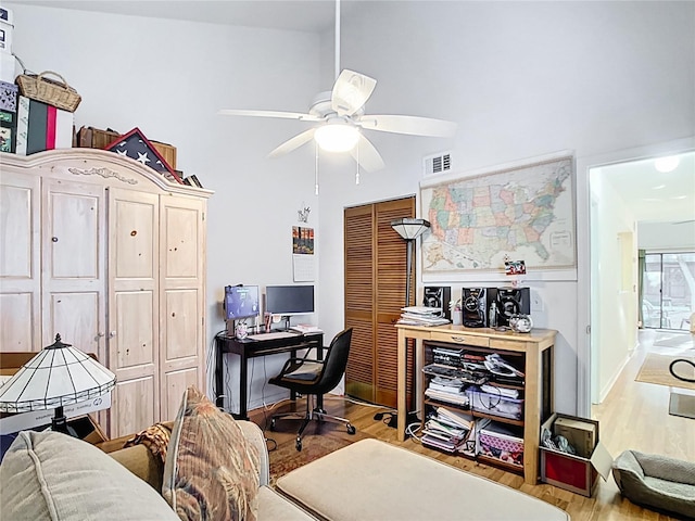 office featuring visible vents, ceiling fan, and wood finished floors