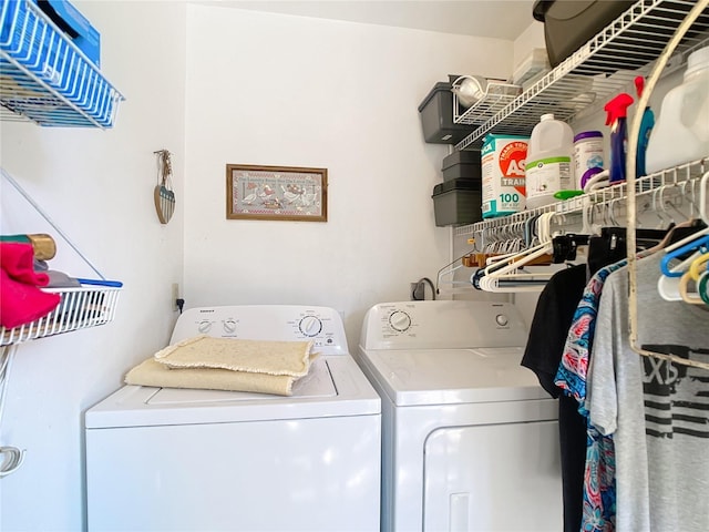 laundry area featuring washer and dryer and laundry area