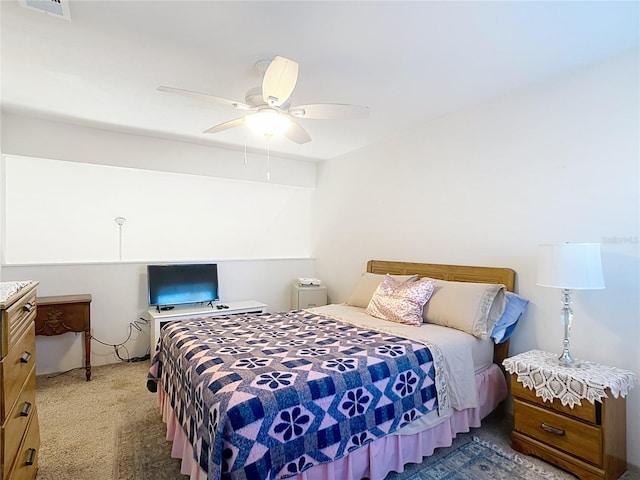 bedroom with visible vents, ceiling fan, and carpet floors