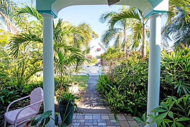 view of patio featuring fence and a gate