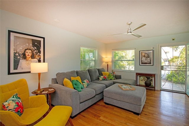 living room featuring wood finished floors and a ceiling fan