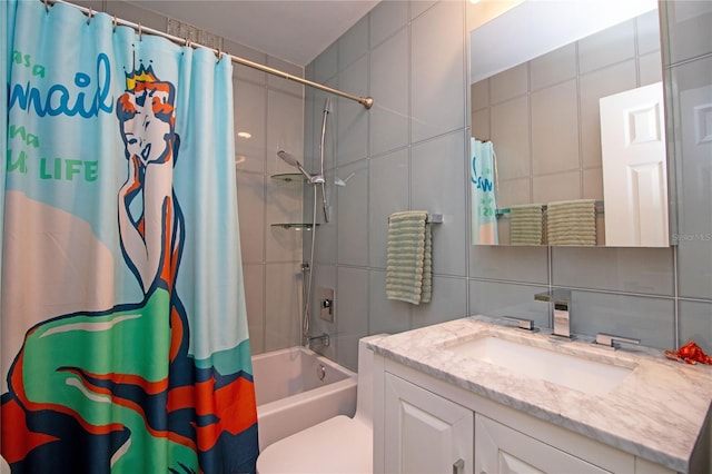 full bathroom featuring toilet, backsplash, tile walls, shower / bath combination with curtain, and vanity