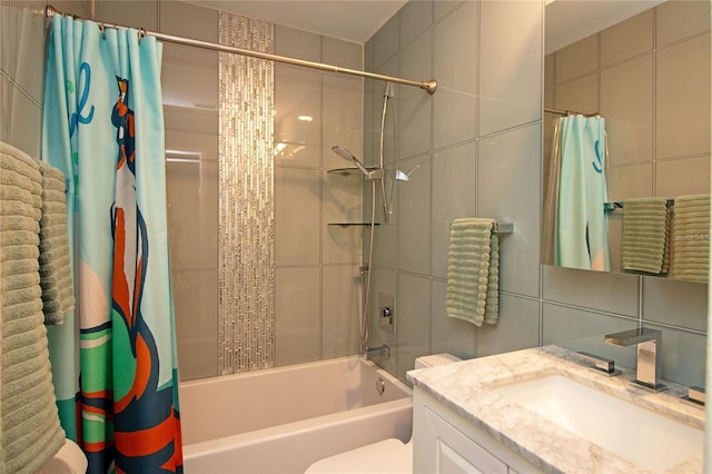 full bathroom featuring toilet, vanity, decorative backsplash, shower / bath combination with curtain, and tile walls