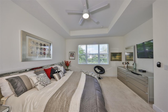 807 Chipper Dr, Sun City Center, FL 33573 - bedroom featuring a tray ceiling, a ceiling fan, baseboards, and carpet floors