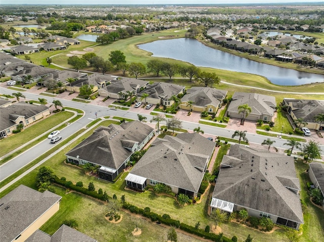 807 Chipper Dr, Sun City Center, FL 33573 - drone / aerial view featuring golf course view, a residential view, and a water view