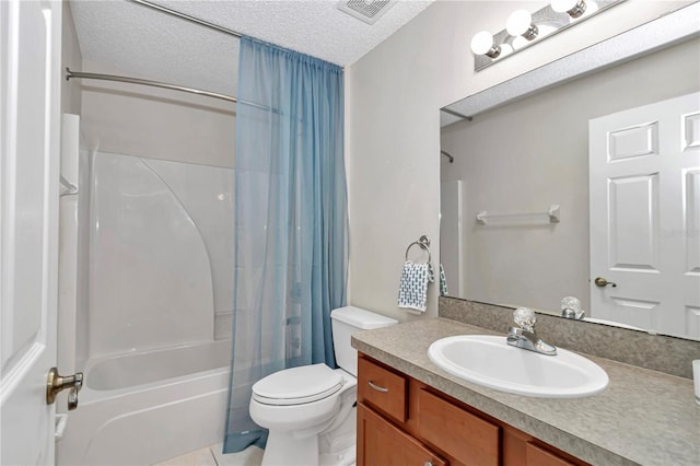 bathroom with shower / tub combo with curtain, toilet, a textured ceiling, tile patterned flooring, and vanity