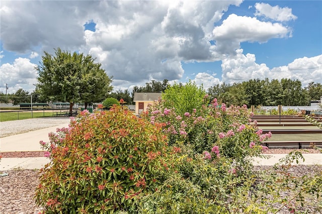 view of community featuring fence