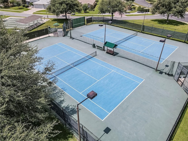 view of tennis court with fence