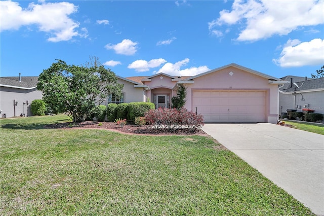 single story home with stucco siding, concrete driveway, a garage, and a front yard