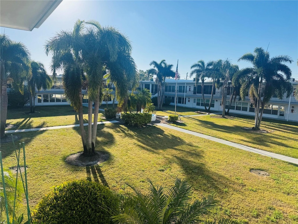 view of home's community featuring a lawn