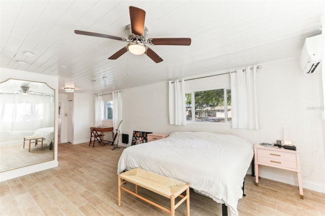 bedroom featuring wood ceiling, baseboards, an AC wall unit, and light wood-style floors