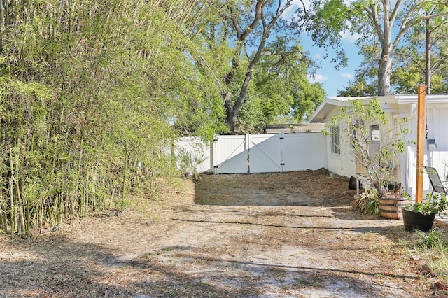 view of yard featuring a gate and fence