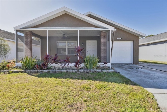 view of front facade featuring stucco siding, a front lawn, concrete driveway, and an attached garage