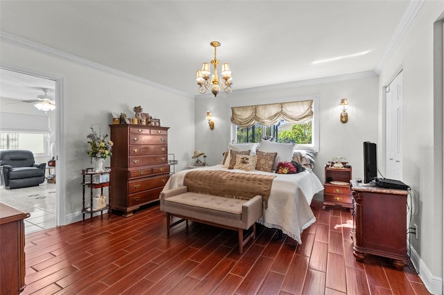 bedroom featuring an inviting chandelier, multiple windows, and wood finish floors