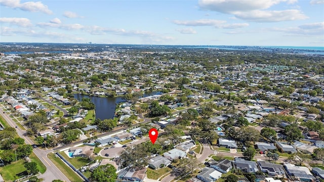 bird's eye view with a residential view and a water view