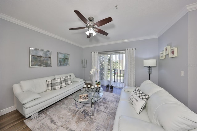 living room with baseboards, crown molding, a ceiling fan, and wood finished floors