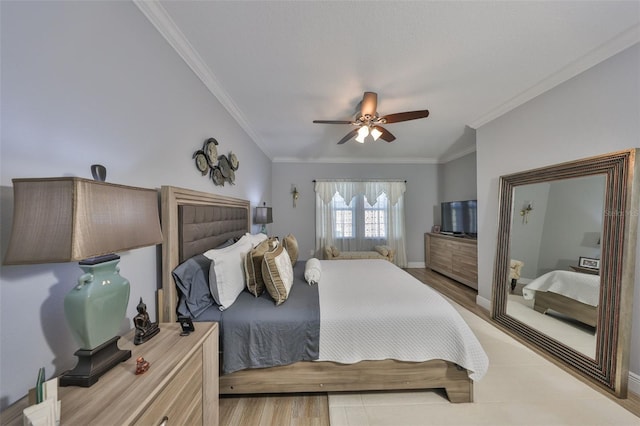 bedroom featuring ceiling fan, baseboards, light wood-style floors, and ornamental molding