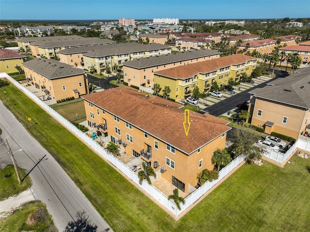 birds eye view of property with a residential view