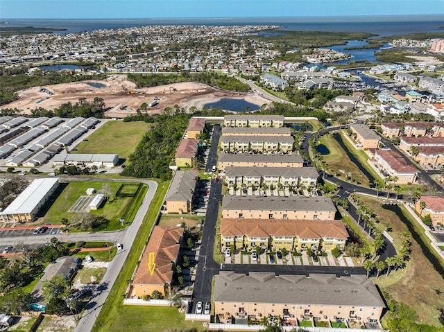 bird's eye view featuring a water view and a residential view