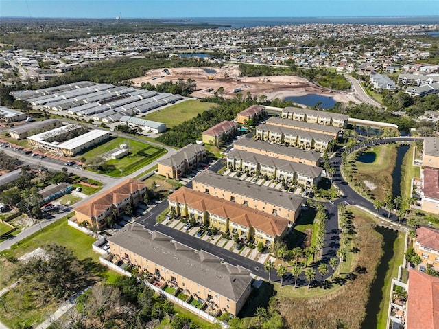 birds eye view of property with a residential view