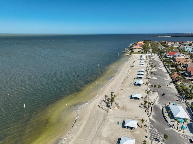 bird's eye view with a water view and a beach view