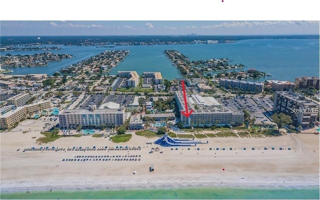 bird's eye view featuring a beach view, a view of city, and a water view