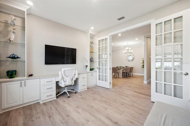 office space with visible vents, recessed lighting, french doors, light wood-style floors, and a notable chandelier