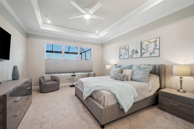 carpeted bedroom with ceiling fan, baseboards, a tray ceiling, ornamental molding, and recessed lighting