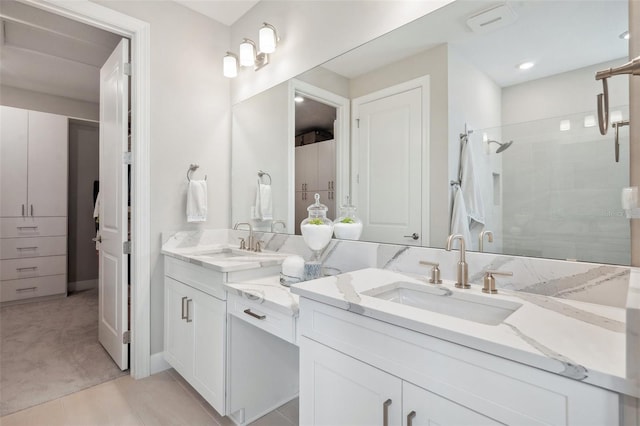 bathroom featuring vanity, a stall shower, and tile patterned flooring